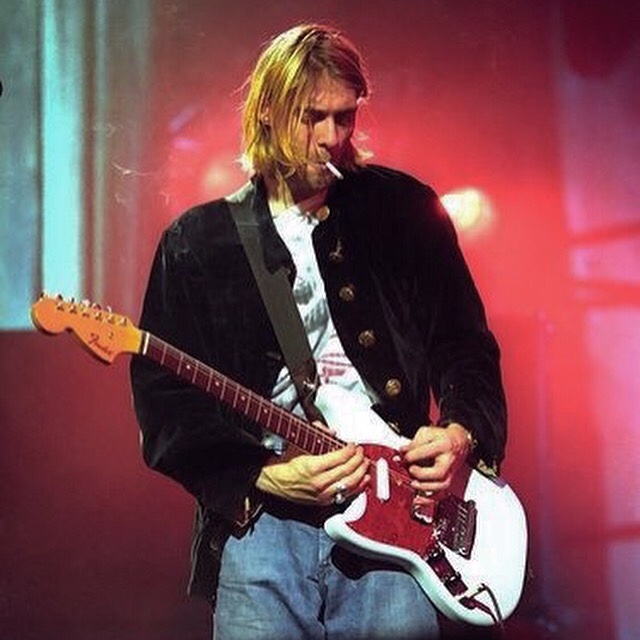Nirvana's Kurt Cobain playing the Fender Jag-Stang whilst smoking