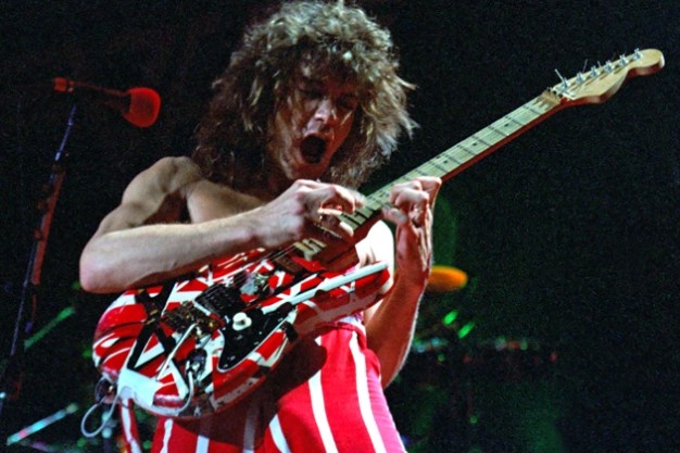 Eddie Van Halen finger tapping on his red and white custom “Frankenstrat”