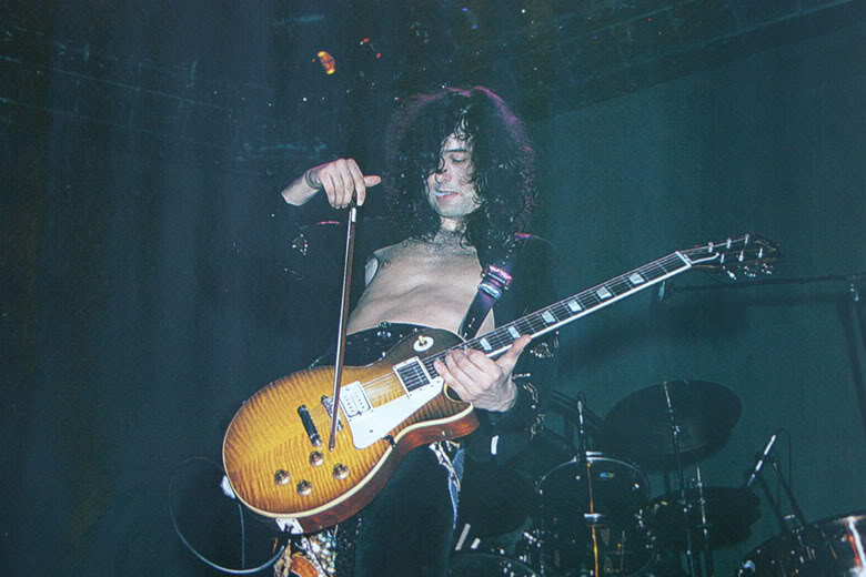 Jimmy Page playing his sunburst Gibson Les Paul Standard on stage