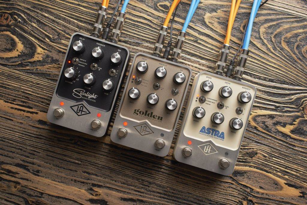 Lifestyle image of all three Universal Audio UAFX pedals.