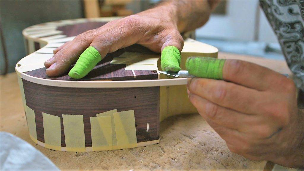 Adding the binding to a guitar