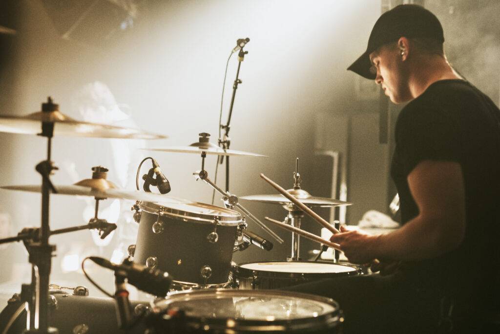 Stock image of a drummer performing live.