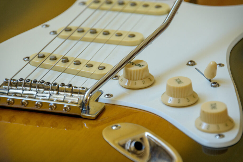 Close-up photo of a Fender Stratocaster's controls.