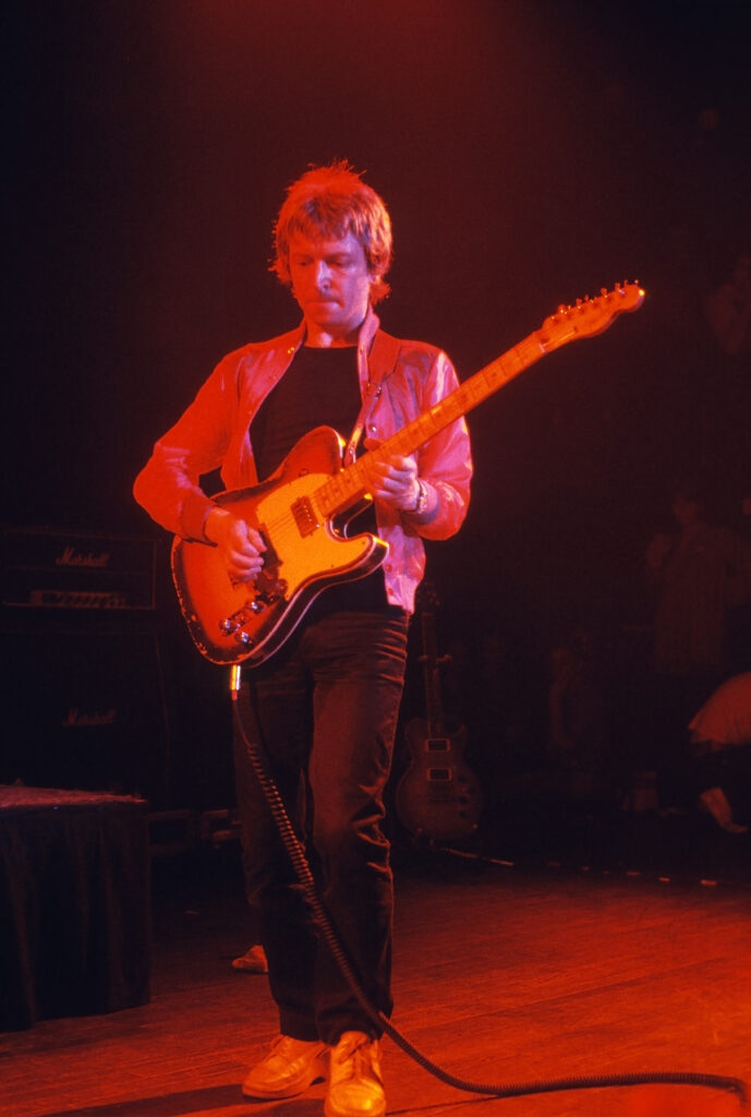 Andy Summers playing a Telecaster onstage with The Police.